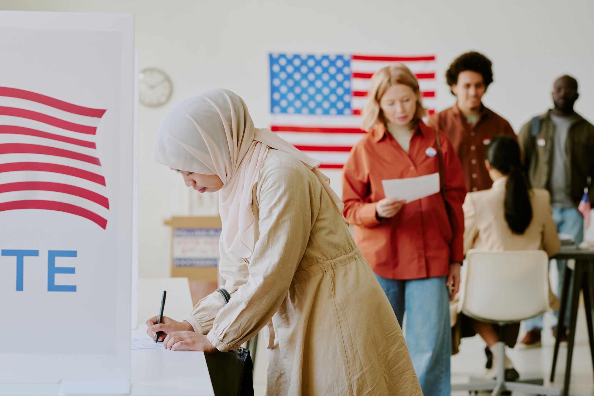 Muslim Woman Casting Vote On Election Day